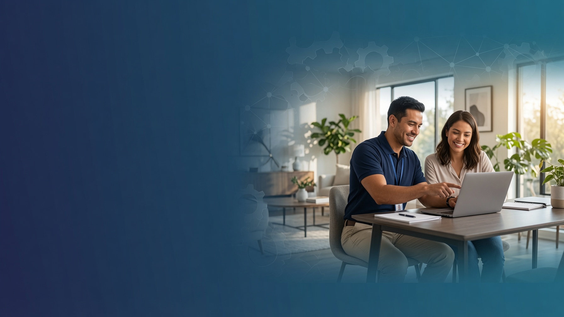 A friendly GuyFixIt technician helping a customer at home with their laptop